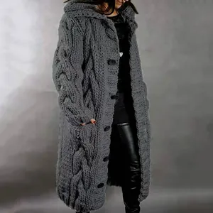 Close-up of women's long cable-knit cardigan with hood and chunky buttons in grey.
