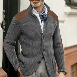 Close-up of men's grey waffle-knit cardigan showing brown shoulder patch detail