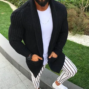 Detail view of men's chunky black knitted cardigan with ribbed texture and slim fit