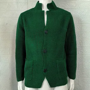 Close-up of men's dark green waffle knit cardigan featuring a stand collar and buttons