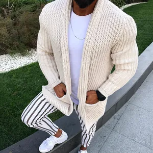 Detailed view of a men's slim fit chunky cream knitted cardigan with long sleeves.