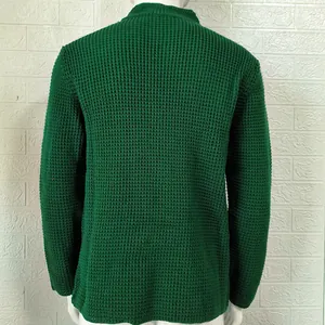 Detailed back view of a men's green waffle-knit cardigan sweater on a white mannequin.