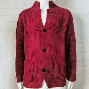 Detailed view of a red waffle knit cardigan sweater for men with a slim-fit standing collar design