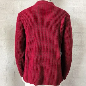 Macro detail of the red waffle-knit pattern on a men's mock neck slim-fit knitted cardigan