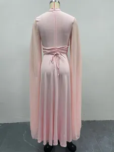Back view of pink party dress featuring elegant tie-back design and flowing cape sleeves