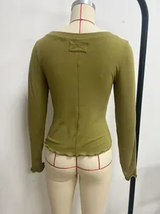 Back view of olive green slim-fit long sleeve top featuring lettuce edge hem detail