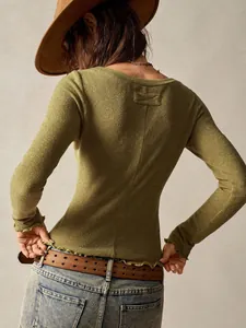 Back view of retro long-sleeve green top with lettuce edge hem and ribbed texture