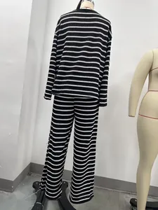 Back view of black and white striped long-sleeve loungewear set on a mannequin