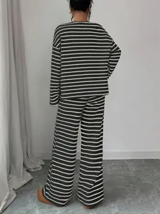 Back view of a relaxed striped lounge set featuring long sleeves and wide-leg trousers.