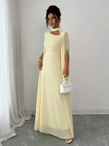 Elegant pale yellow cape maxi dress for banquet parties, showing full length view.