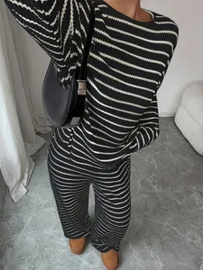 Detailed view of the black and white striped long sleeve top and pants set