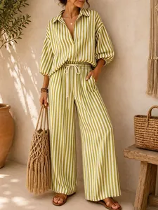 Detailed view of the elegant green and white striped shirt and matching wide-leg trousers set