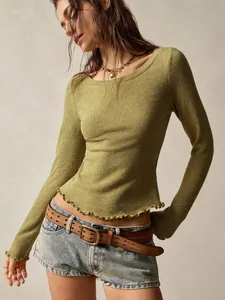 Detailed macro view of olive green slim-fit textured knit top with vintage lettuce edge hem.