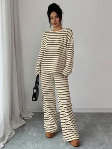 Full view of elegant striped knit two-piece lounge set with long sleeves and wide-leg pants