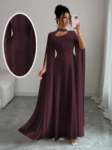 Detailed view of back lacing and cape sleeves on this elegant burgundy evening gown.