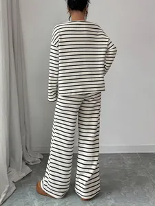 Back view of a chic black and white striped long-sleeve loungewear set for women