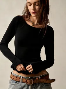 Detail of vintage black long sleeve T-shirt with lettuce edge hem and ribbed texture