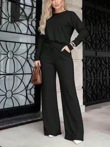 Elegante conjunto de salón negro de dos piezas con top de manga larga y pantalón ancho