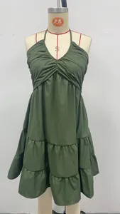 Detailed macro view of an olive green halter v-neck ruffle dress for summer resort