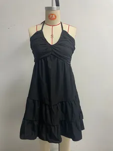 Elegant black halter V-neck dress featuring ruffled tiered hem for summer vacation style