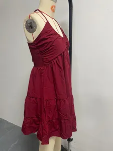 Burgundy halter V-neck tiered dress with ruffle details for summer vacation.
