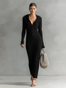 Elegant black slim fit hooded knitted maxi dress with ribbed texture and front buttons.