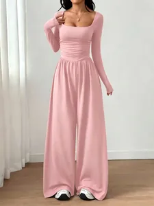 Elegant pink square neck long sleeve jumpsuit with wide leg trousers for women.