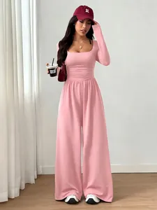 Stylish pink long sleeve square neck wide leg jumpsuit with a slim fit waist design
