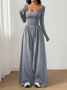 Elegant grey long sleeve square neck wide leg jumpsuit with pleated waist detail