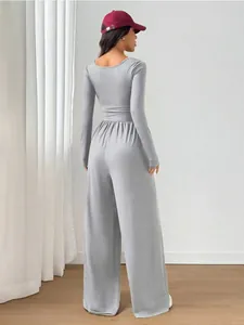 Detailed back view of a stylish grey long-sleeved jumpsuit featuring casual wide-leg pants.