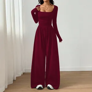 Elegant burgundy long sleeve square neck wide leg jumpsuit featuring a slim fit silhouette