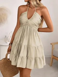 Elegant beige halter neck V-neck tiered ruffle mini dress perfect for summer beach vacation
