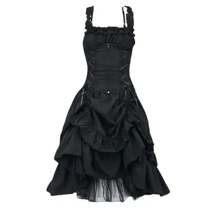 Full-length detail of black ruffled dress showing corset lacing and asymmetrical hemline