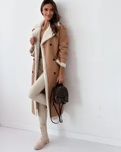 Detail view of a stylish camel faux leather coat with plush white shearling lining and collar