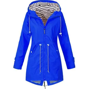 Detailed view of women's blue hooded rain jacket with classic striped lining and drawstring waist