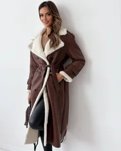 Stylish detail of long brown faux leather coat with white shearling trim and lapels