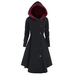 Detailed view of women's black hooded coat with wine red lining and asymmetrical buttons