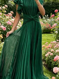 Elegant emerald green pleated maxi dress with cross-waist design in lush rose garden