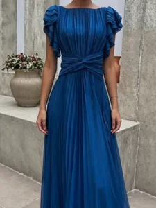 Elegant dark blue pleated maxi dress with ruffled sleeves and twisted waist detail.