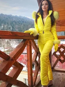 Yellow women's waterproof one-piece ski suit with fur hood and matching gloves