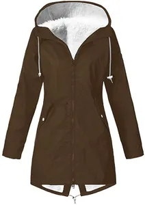 Close-up detail of brown waterproof hooded parka with warm white fleece lining