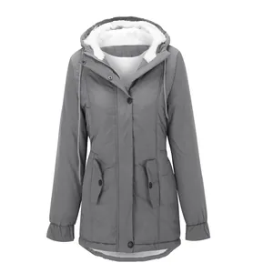 Close-up view of women's gray winter parka featuring a cozy white fleece lining.
