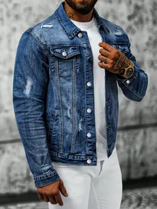 Close-up of distressed blue denim jacket for men featuring ripped details and slim fit