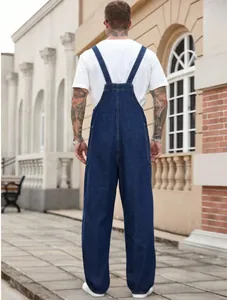 Detailed rear view of men's blue denim overalls showing the back straps and loose fit