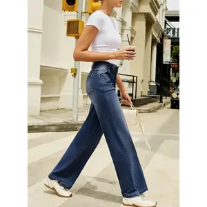High-waisted wide-leg denim jeans for women in dark blue shown in an urban street setting