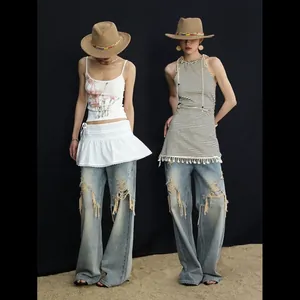 Jean large pour femme style High Street avec détails déchirés et effet vieilli unique