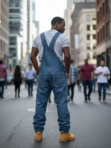 Classic men's blue denim overalls in a loose straight-leg fit for urban street style
