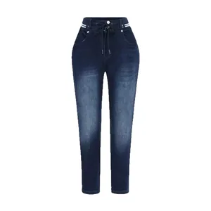 Close-up of women's dark blue jeans featuring a drawstring elastic waist with stripe detail