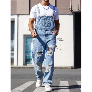 Trendy men's light blue distressed denim overalls with adjustable straps and ripped details