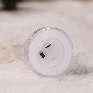 Macro detail of the bottom power switch and battery compartment of nativity night light